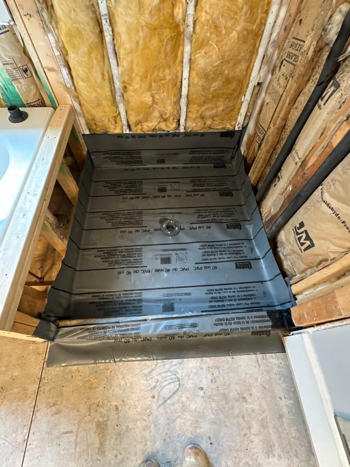 Fully waterproofed custom shower pan liner before tile